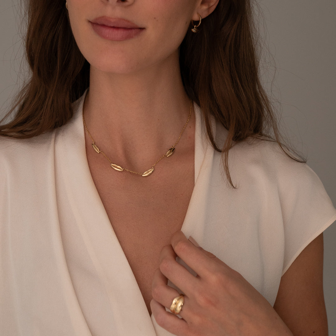 Gold Four Petite Kiss Necklace