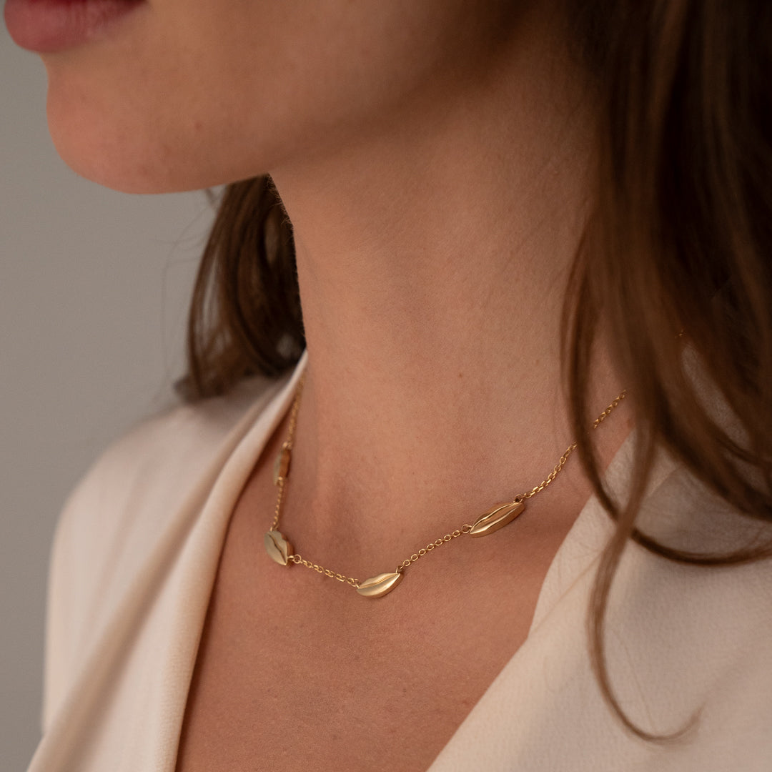 Gold Four Petite Kiss Necklace