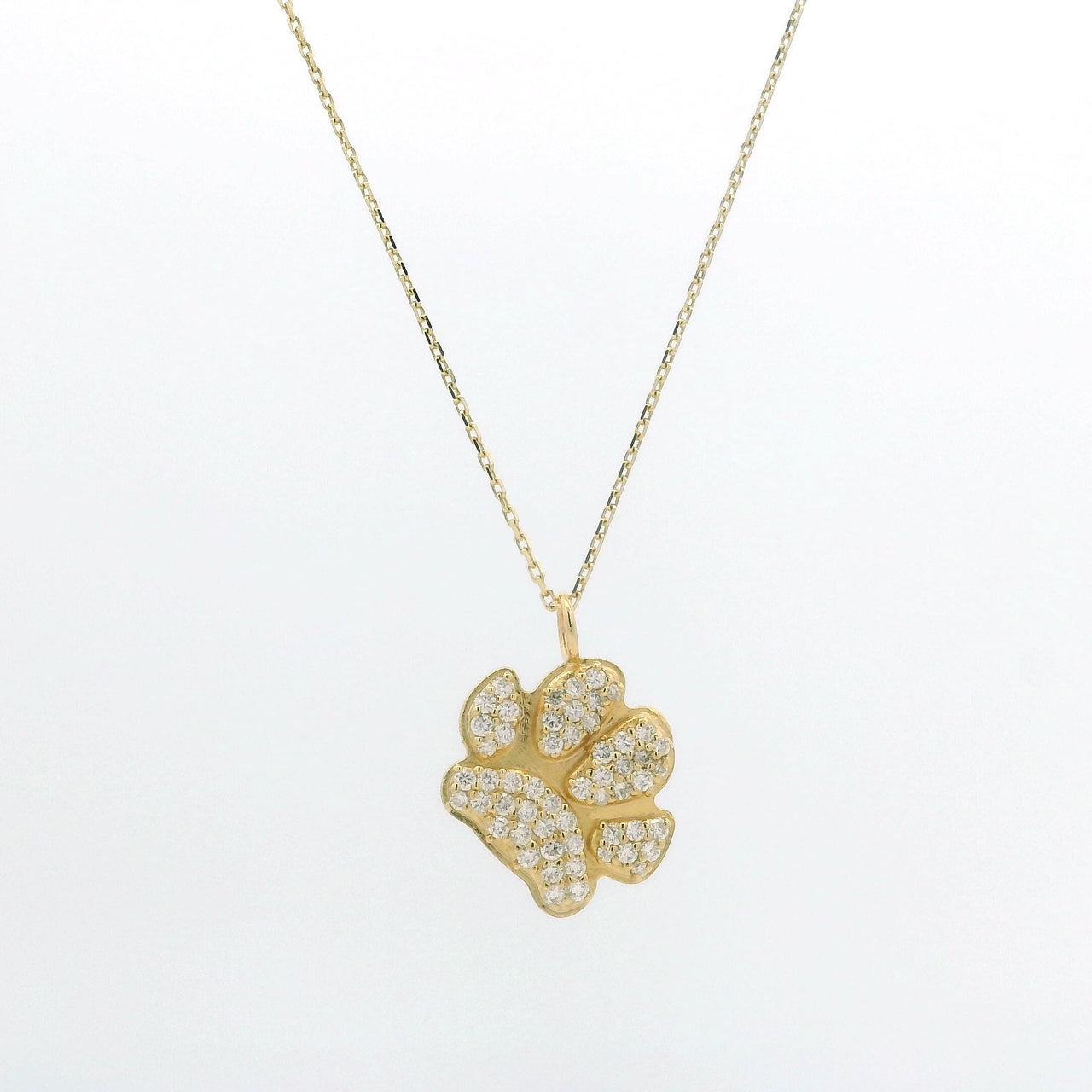 A gold chain featuring an ilMio Custom Paw Print Charm paved diamonds set against a plain white background.