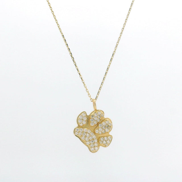 A gold chain featuring an ilMio Custom Paw Print Charm paved diamonds set against a plain white background.